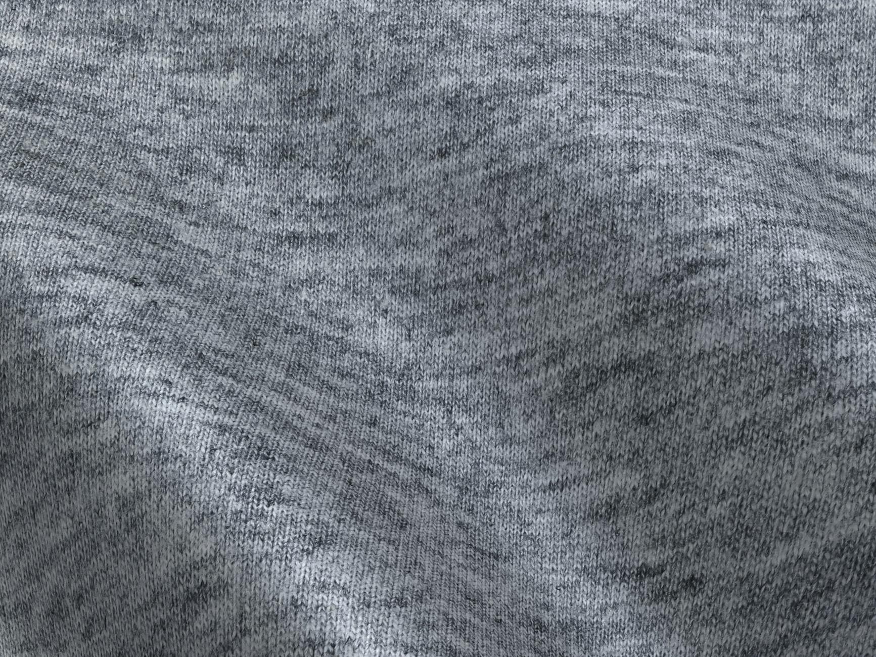 Close-up of soft gray knitted fabric, showcasing texture and gentle folds.
