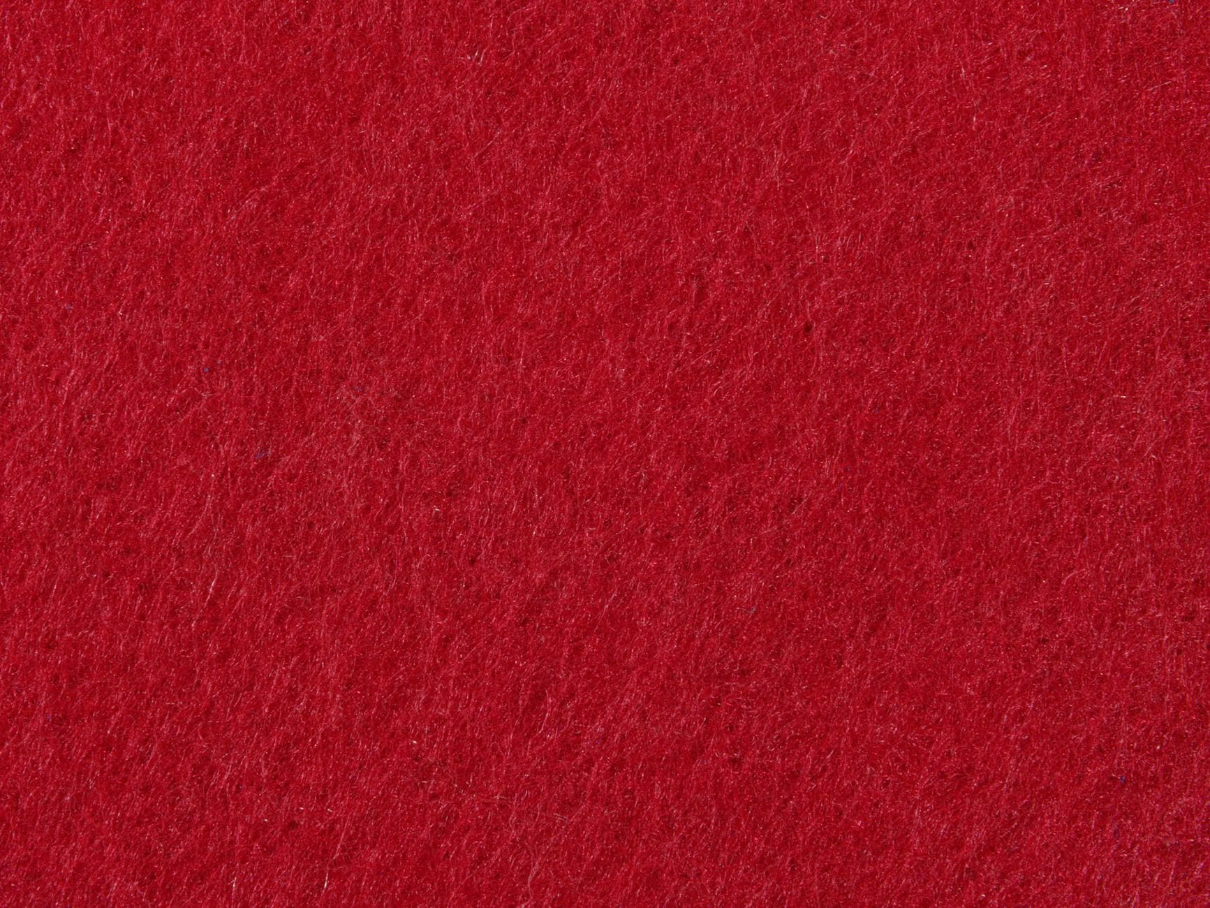 Close-up of a vibrant red textured fabric, offering rich color and depth.