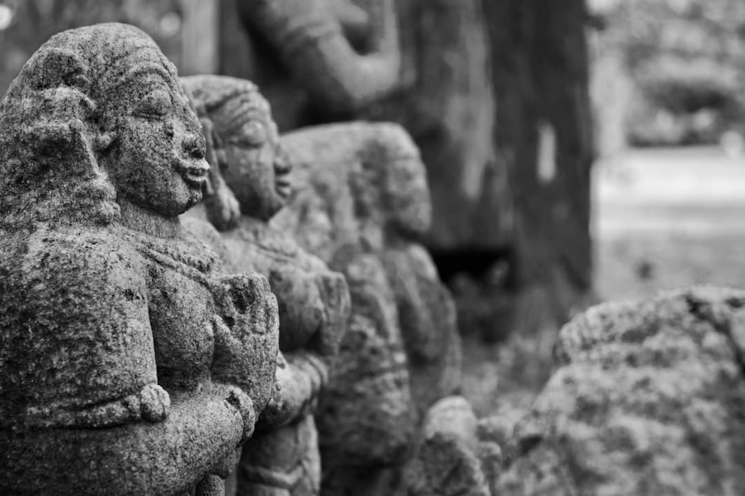 black and white photograph of a row of statues