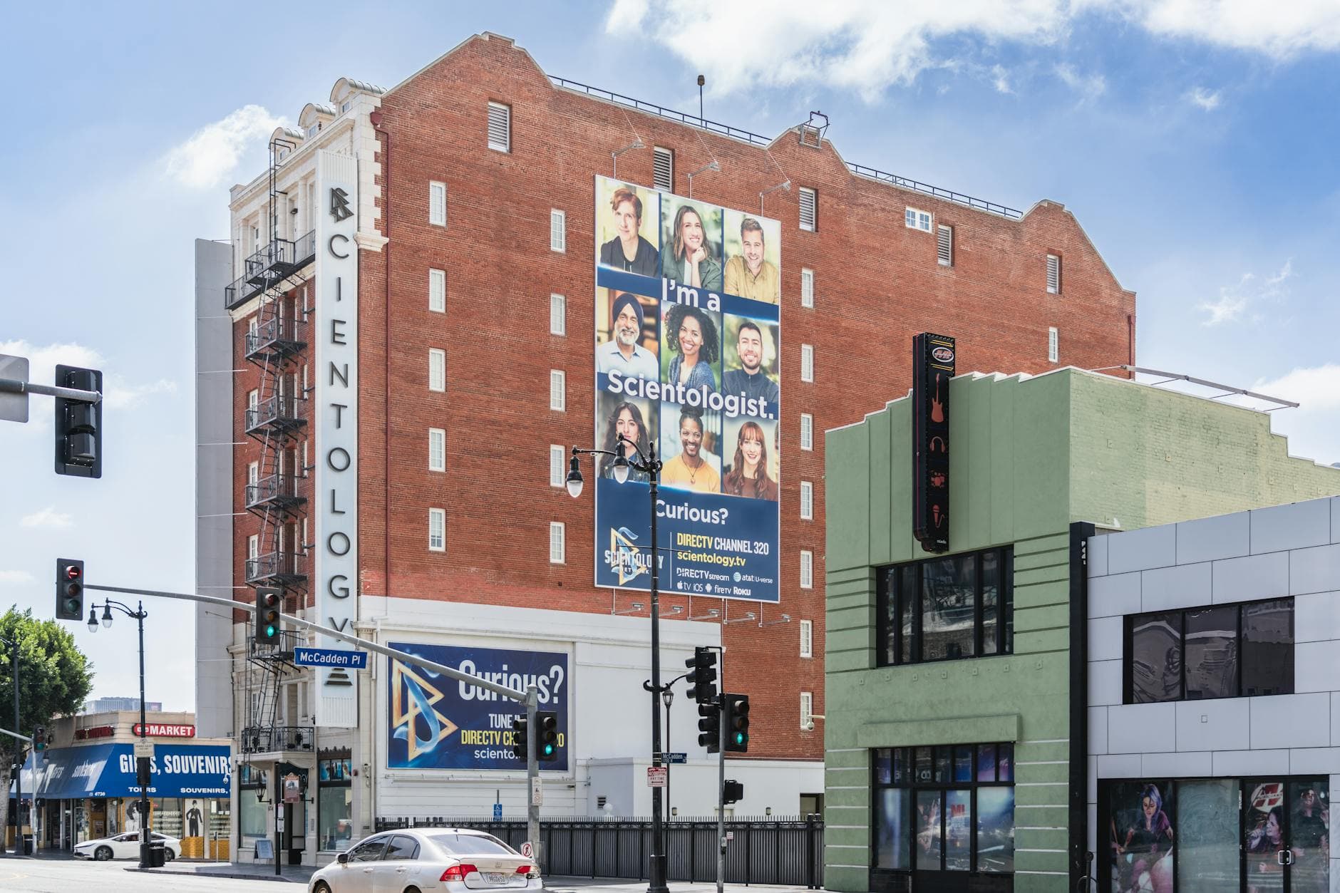 Scientology Church building with prominent billboard on Sunset Boulevard, Los Angeles.