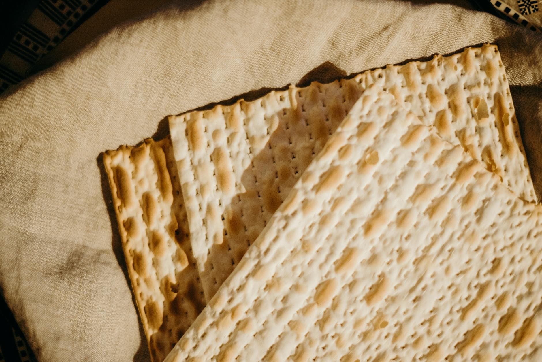 Close-up view of traditional matzah used during Passover celebrations.